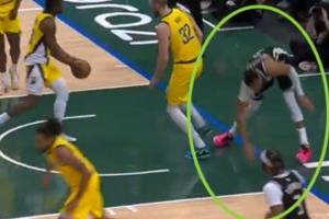 崴脚+膝盖过度伸展!字母哥扣篮落地失衡 捂着左膝!